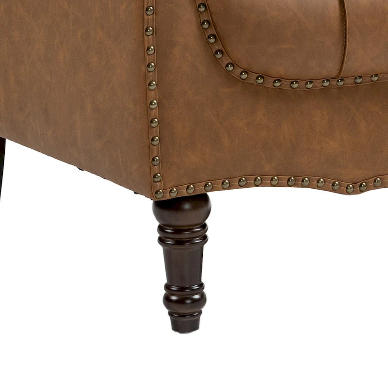 Fauteuil d'appoint capitonné en similicuir avec accoudoirs cloutés